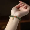 Hetian Jade Buddha Bead Bracelet with Red Agate