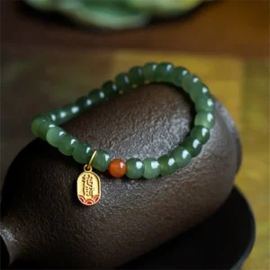 Hetian Jade Buddha Bead Bracelet with Red Agate